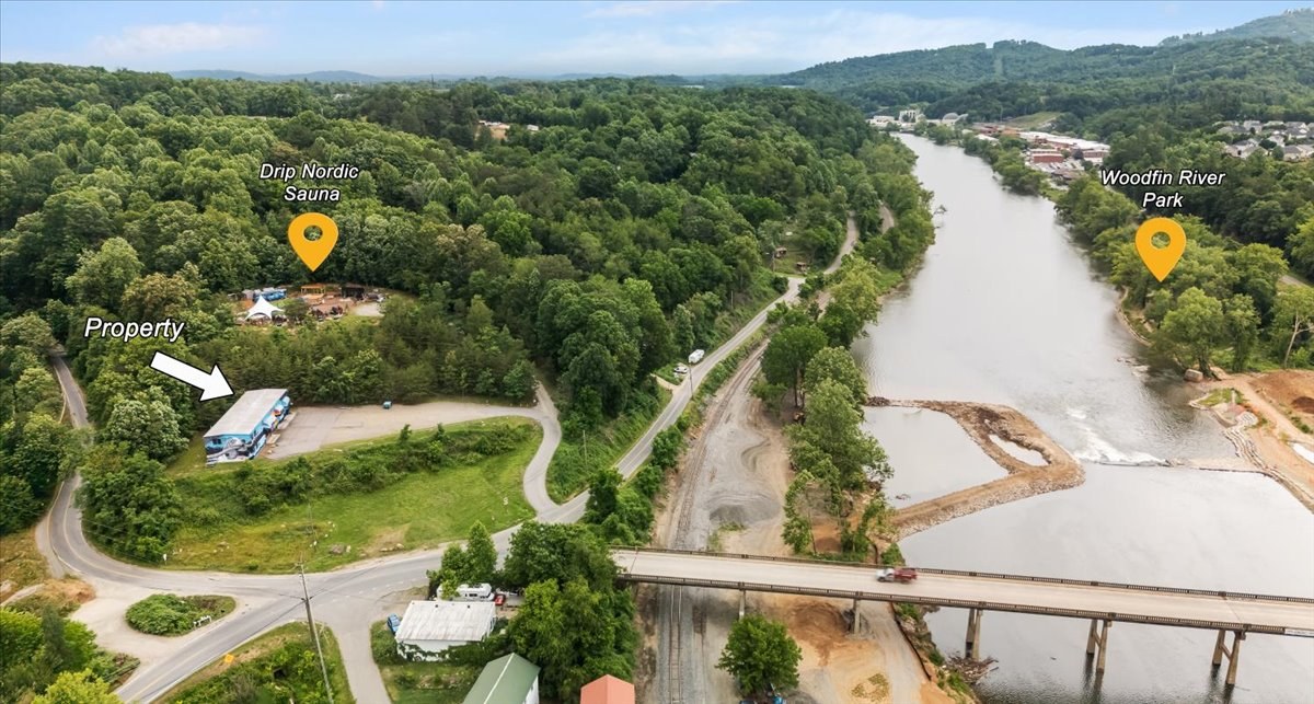 Aerial drone photo showing property location with Drip Nordic Sauna and Woodfin River Park labeled