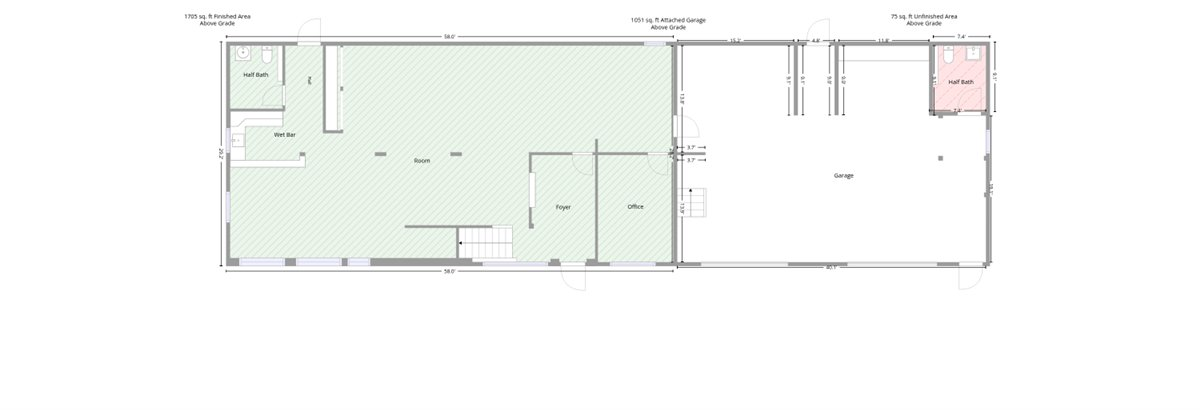 First floor plan showing finished area, attached garage with bay doors, and bathroom layout